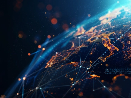 Close-up digital render of Earth showing Europe illuminated with city lights, overlaid with blue lines/bright nodes symbolizing global connectivity.