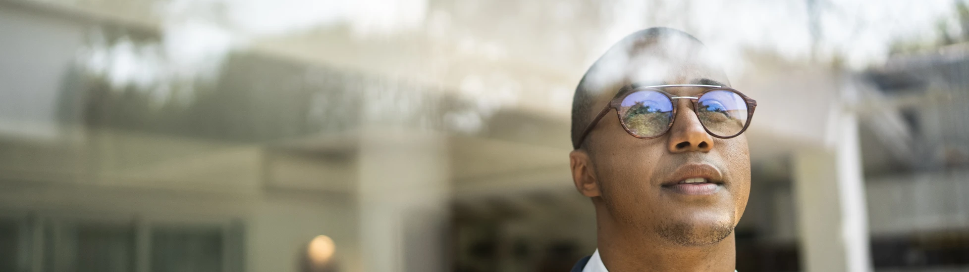 man looking out of window