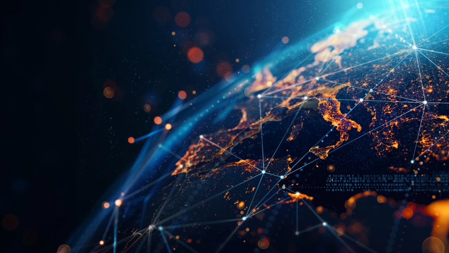 Close-up digital render of Earth showing Europe illuminated with city lights, overlaid with blue lines/bright nodes symbolizing global connectivity.